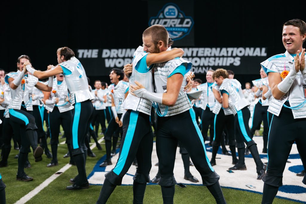 The 2025 DCI World Champions <BR> The Boston Crusaders Hug 1024x683 1